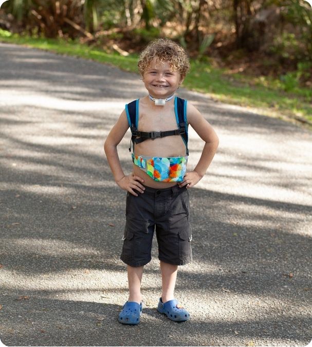 Child smiling with LOCK 3000 belt